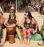 21333095 arambol goa february 5 2013 unidentified people in carnival costumes sit talk play the djembe drum a stock photo